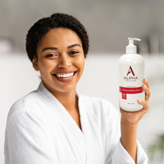 Alpha Skin Care Revitalizing Body Lotion on legs for even tone and softness.