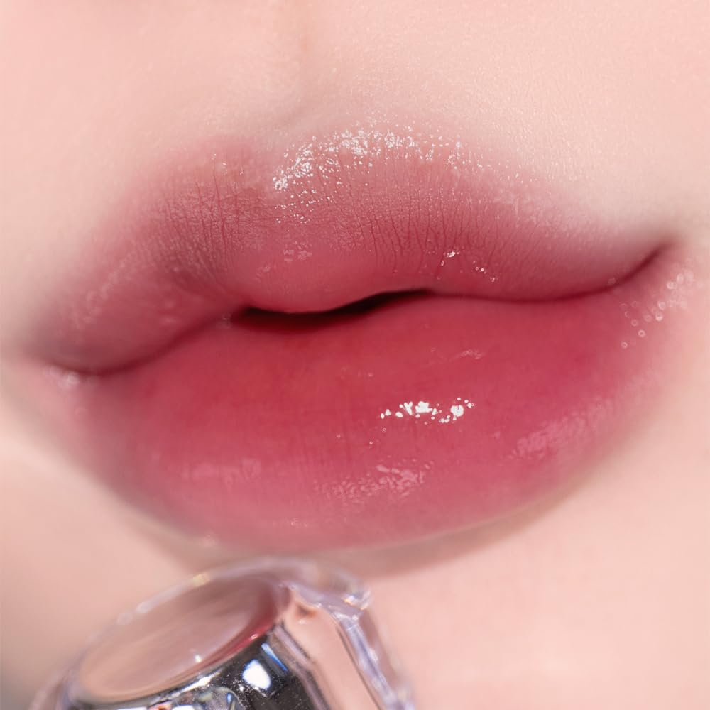 Alternativestereo Lip Potion Aqua Glow No.6 Grape Sherbet swatch reveals sheer purple radiance.