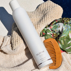 ALURAM Finishing Spray being applied for customizable hold on hair.