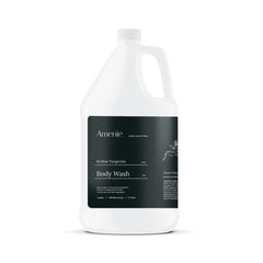 Amenie Sicilian Tangerine body wash bottle with vibrant citrus notes for hotel bathrooms.