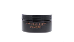 American Crew pomade close-up showing texture and defined strands with gloss.