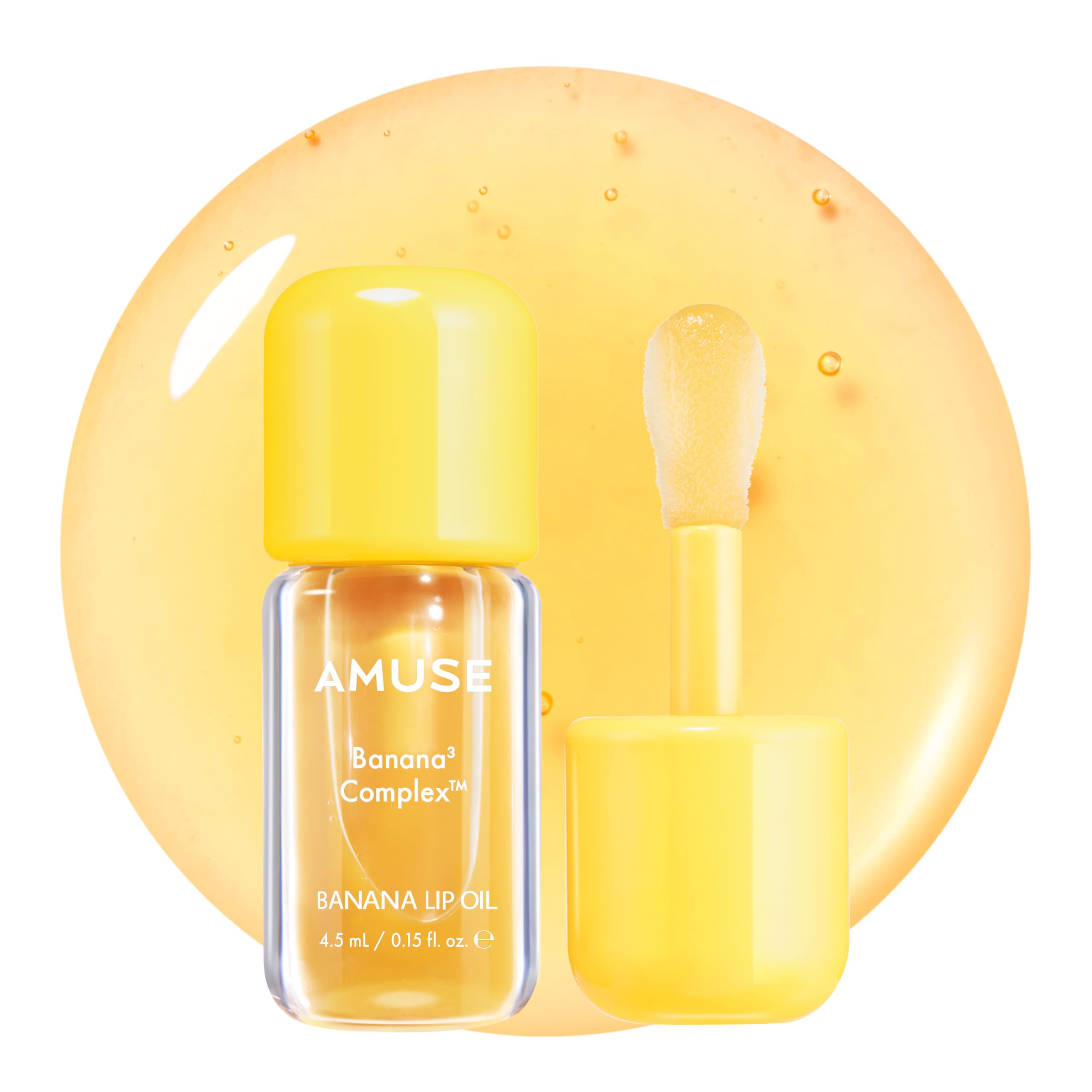 Amuse Seoul Banana Lip Oil bottle closeup showing smooth, hydrated lips with gloss