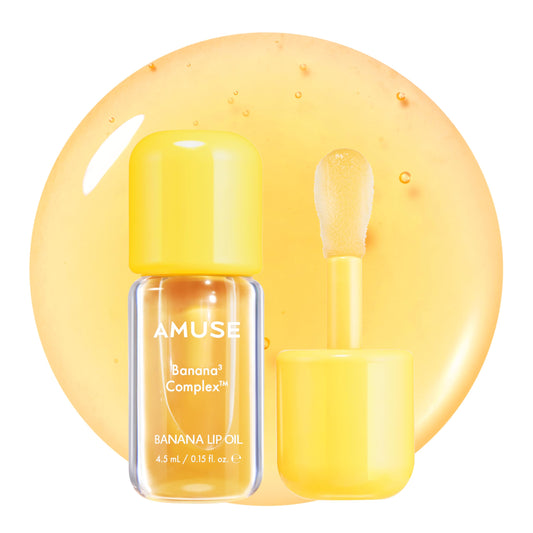Amuse Seoul Banana Lip Oil bottle closeup showing smooth, hydrated lips with gloss