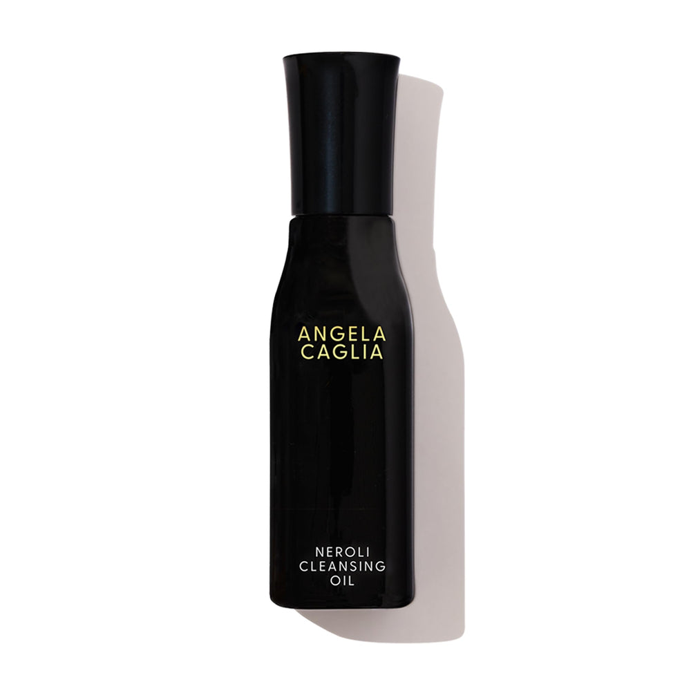 Angela Caglia Neroli Cleansing Oil bottle pour demonstrates hydrating cleanse preserving moisture.