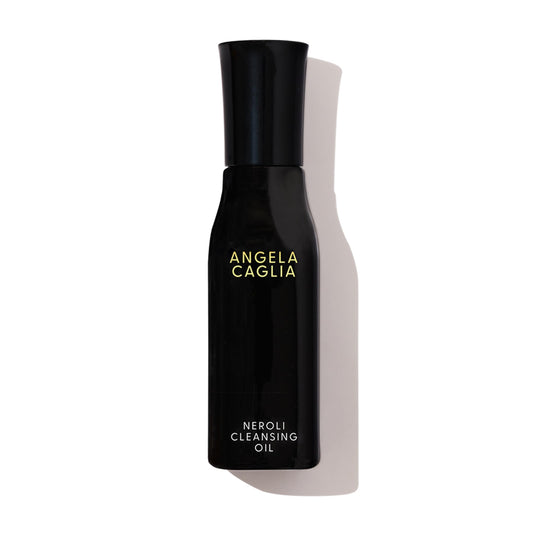 Angela Caglia Neroli Cleansing Oil bottle pour demonstrates hydrating cleanse preserving moisture.