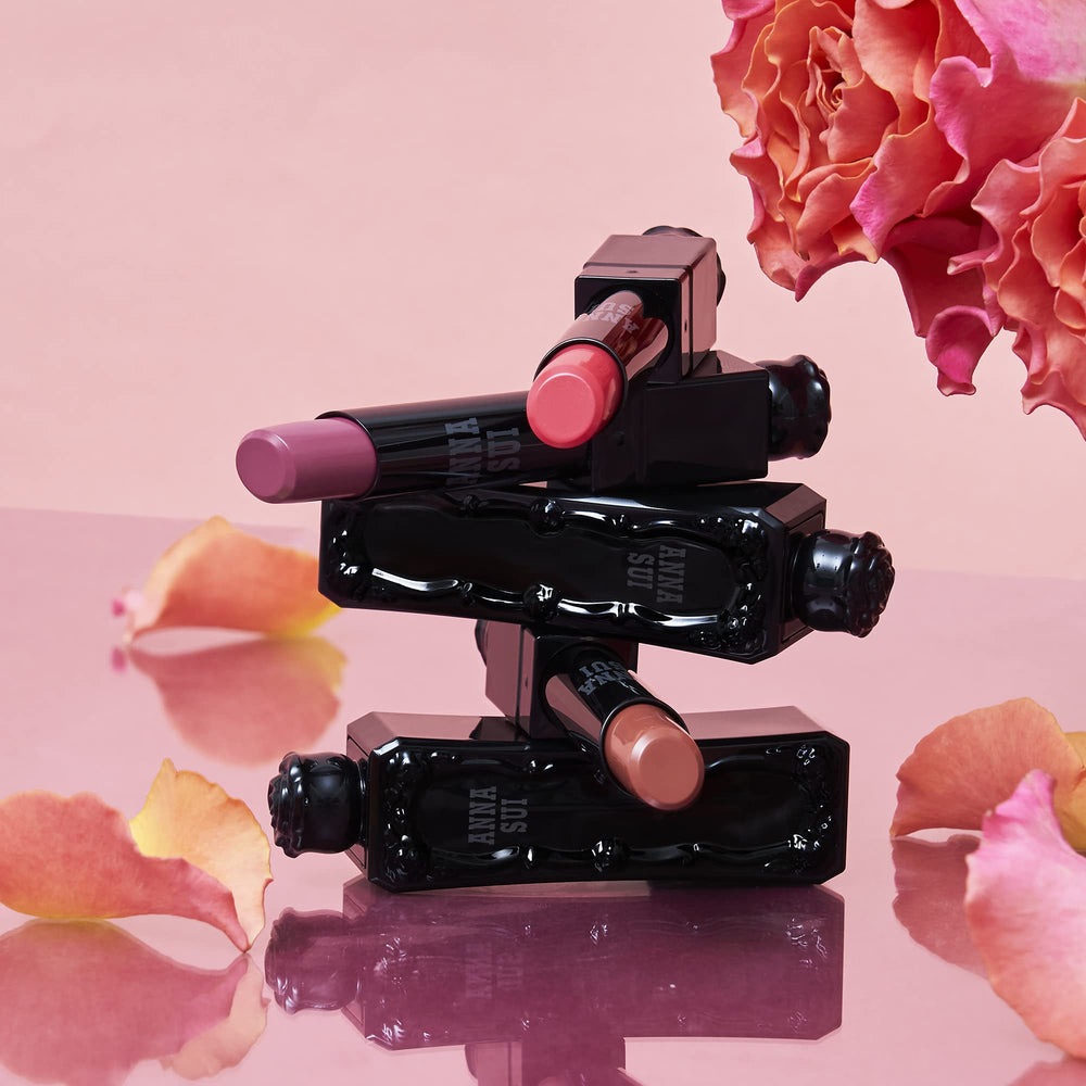 Compact 0.12oz ANNA SUI Lipstick Rouge for on-the-go touch-ups.