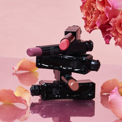 Compact 0.12oz ANNA SUI Lipstick Rouge for on-the-go touch-ups.