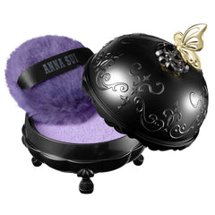 ANNA SUI brightening powder enhances radiance without heaviness.
