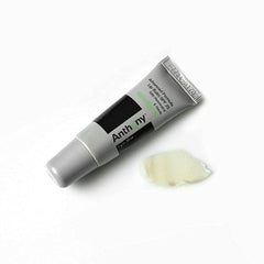 Beach scene with Anthony lip balm guarding lips from sun.