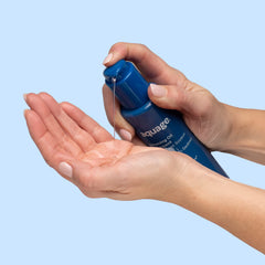 Aquage SeaExtend Silkening Oil on platinum hair demonstrates a colorless formula.