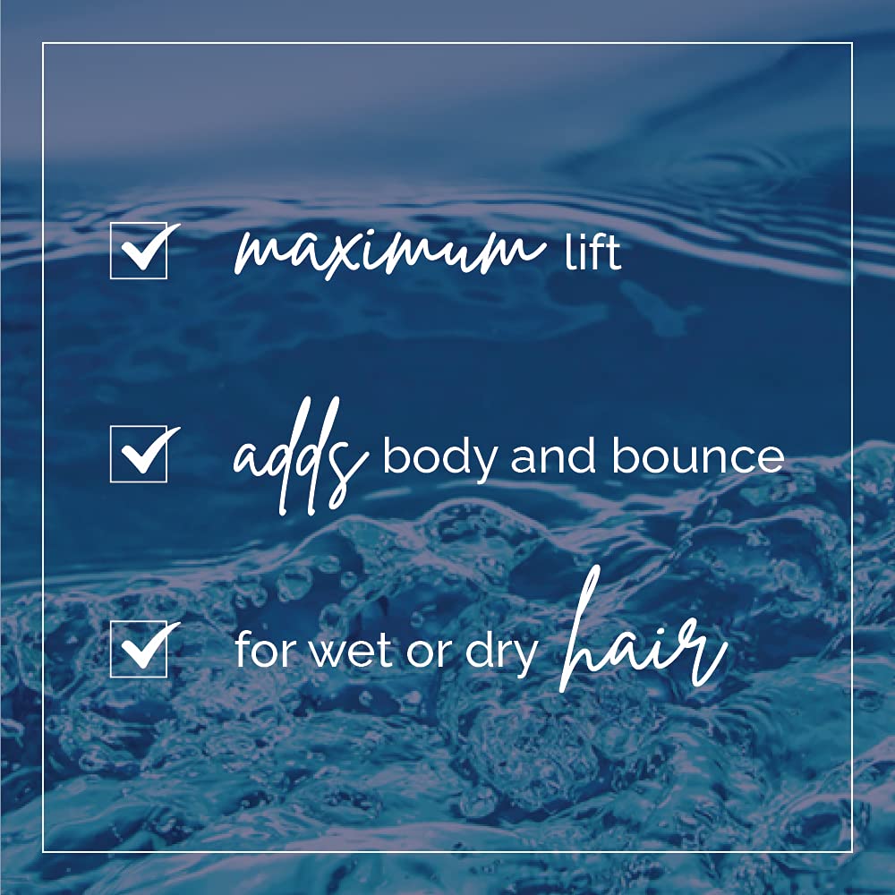 Aquage Uplifting Foam applied on wet hair for even distribution and lift.
