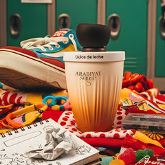 Arabiyat Sugar Dulce De Leche EDP bottle with warm amber hue suggesting gourmand allure