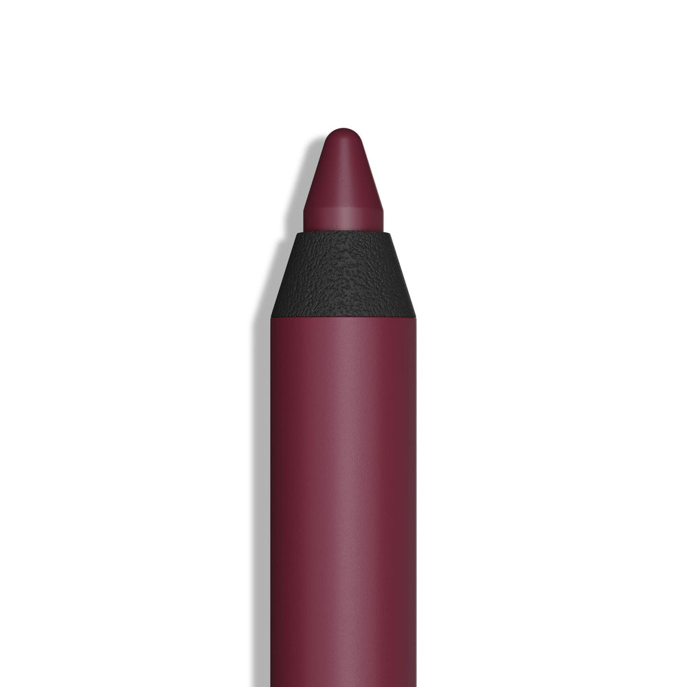Araceli gel pencil eyeliner in wine applied as a smooth stroke for defined eyes.
