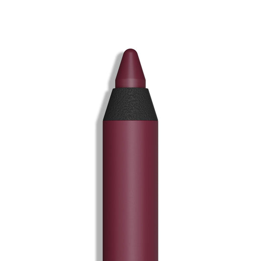 Araceli gel pencil eyeliner in wine applied as a smooth stroke for defined eyes.