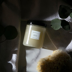 Archipelago Botanicals Coconut Body Scrub scoop application shows gentle exfoliation