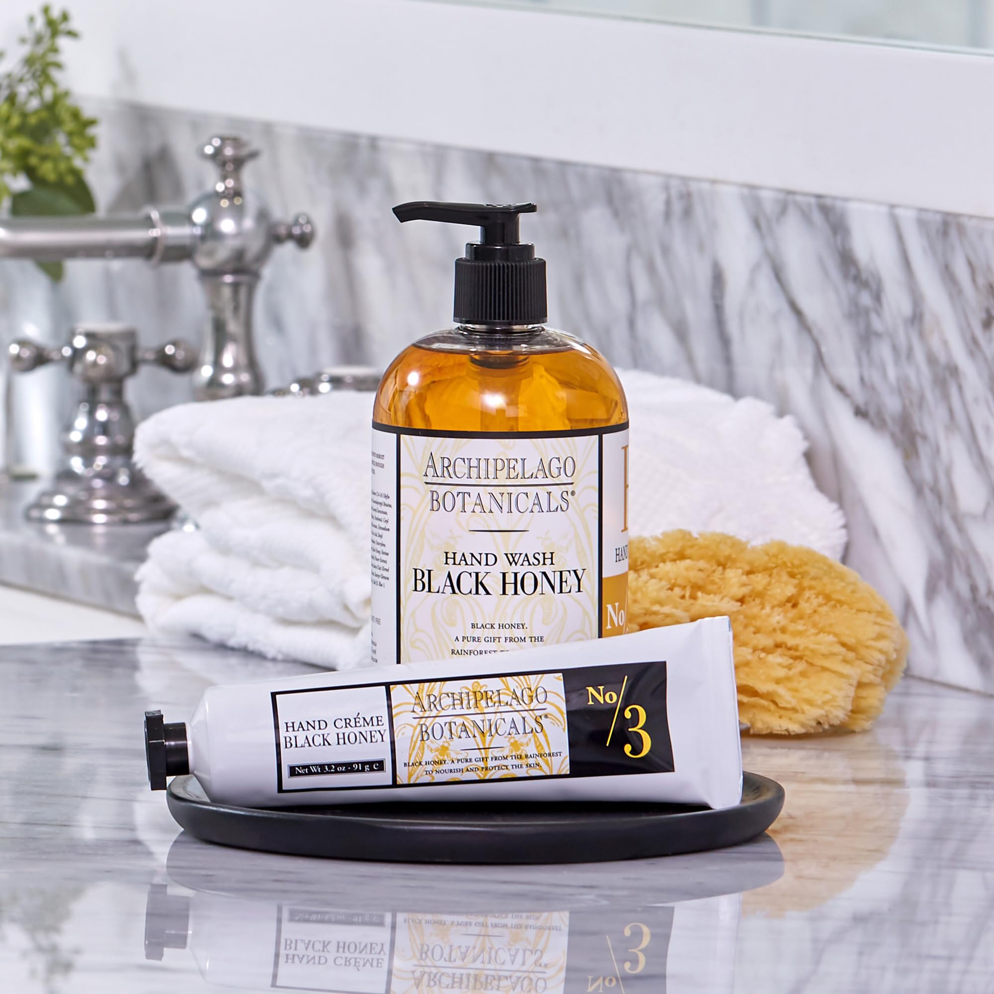 Person applying Archipelago Botanicals Hand Creme to hands after washing