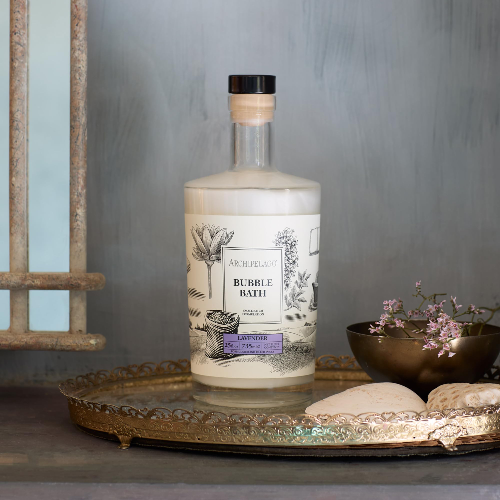 Archipelago Botanicals Lavender Bubble Bath being poured to release luxurious bubbles.