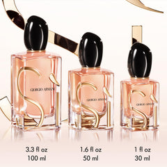 Armani Sì fragrance drops close-up evokes juicy blackcurrant nectar notes for a vibrant opening.