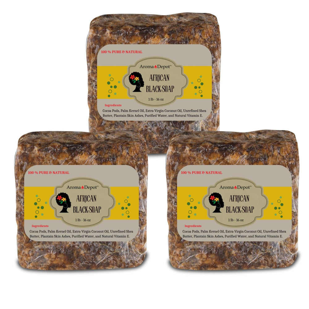 Aroma Depot raw African black soap bar on wood surface for everyday cleansing.