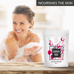AROMATIKA relaxing bath with lit candles and frothy rose-scented foam.