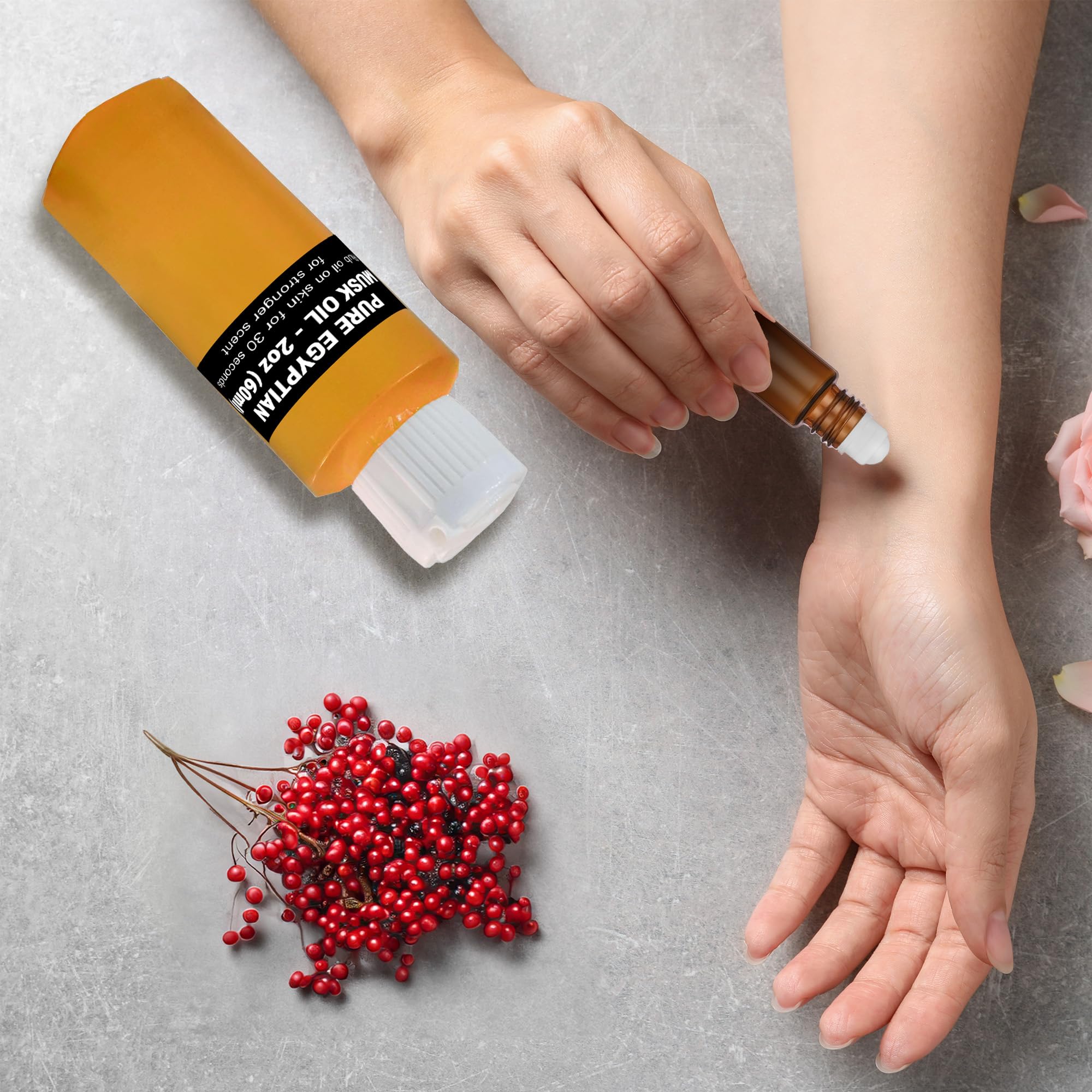 Aromazen Egyptian Musk Oil being rolled on pulse points for quick fragrance application.