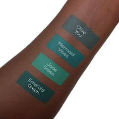 Aromi Emerald Green swatch on skin shows long-lasting color.