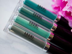 Aromi Emerald Green lip color in a matte finish shade.