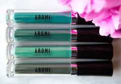 Aromi packaging closeup reveals vegan, cruelty-free commitment.