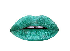 Aromi Mermaid Tail lipstick bottle shows emerald shimmer for bold evening looks