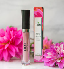 Aromi Sand Nude matte lipstick application close-up highlighting smooth glide.