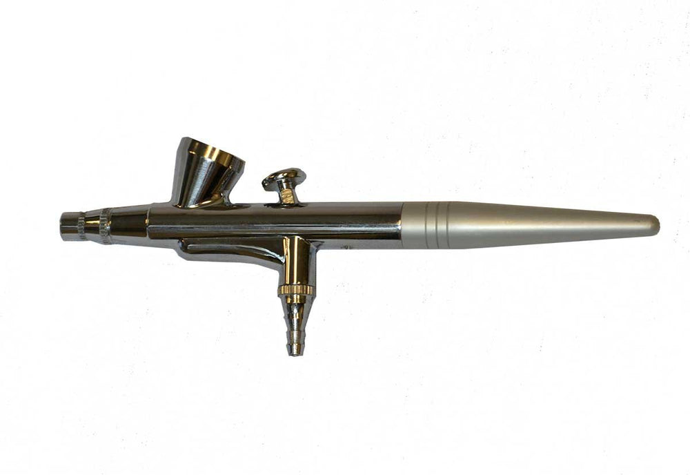 Art of Air compressor and airbrush combo in-use with accessories for precise cosmetic application.