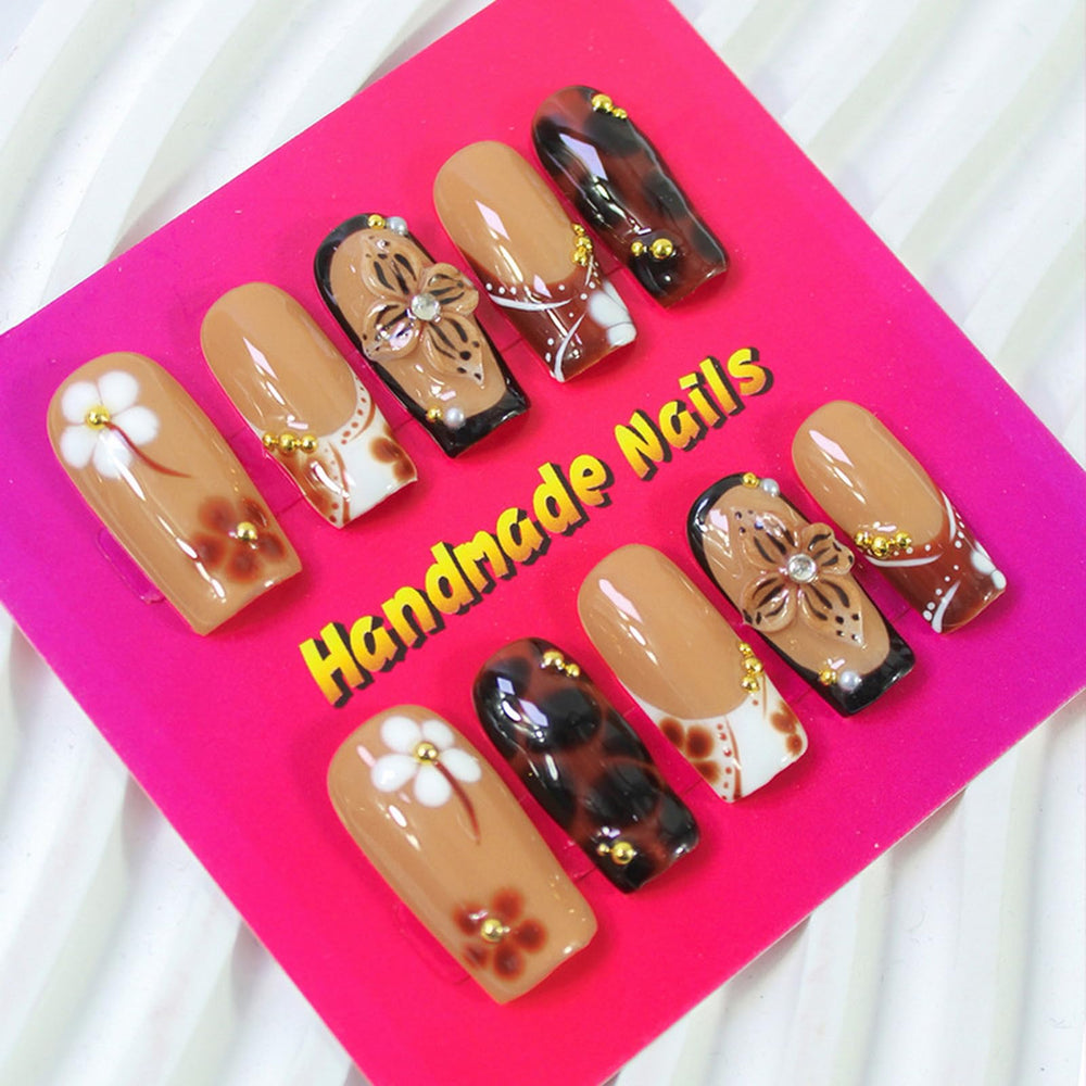 ASABITE glossy finish coffin nails showing rich color and shine.