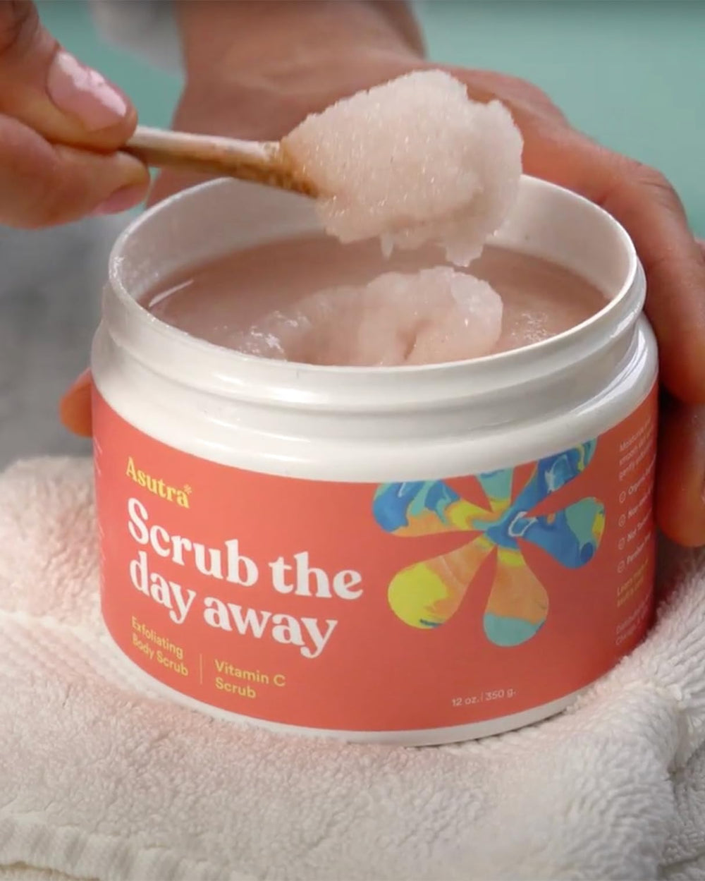 ASUTRA Dead Sea Salt Scrub essential oil blend bottle highlights citrus aroma
