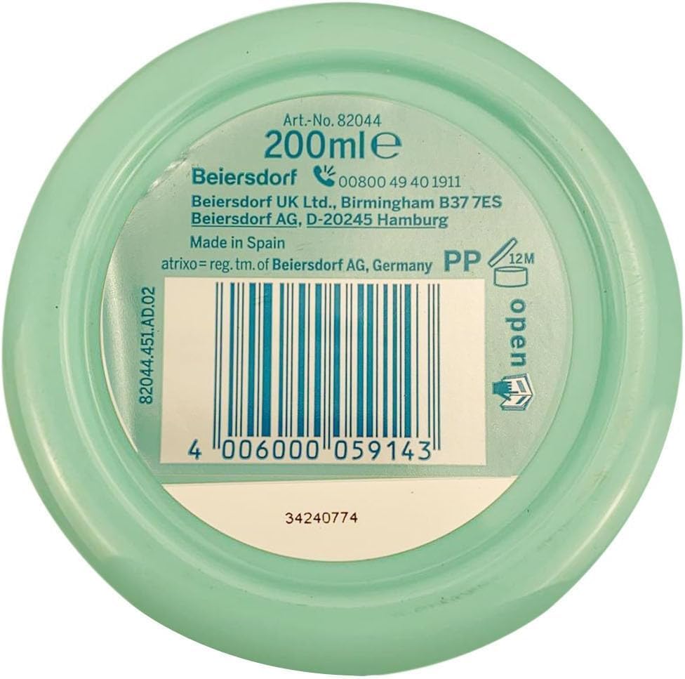 Creamy texture swirl of Atrixo hand cream for smooth application