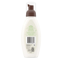 Aveeno Hypoallergenic non-comedogenic formula bottle on bathroom shelf for daily use.