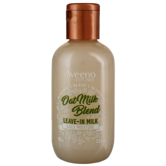 Aveeno Oat Milk Leave-In bottle pour demonstrates lightweight hydration for all hair types.