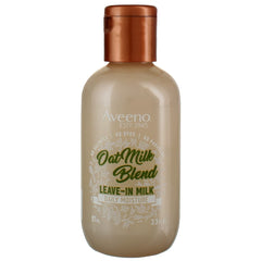 Aveeno Oat Milk Leave-In bottle pour demonstrates lightweight hydration for all hair types.