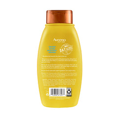 Aveeno conditioner applied to hair for smooth manageability.