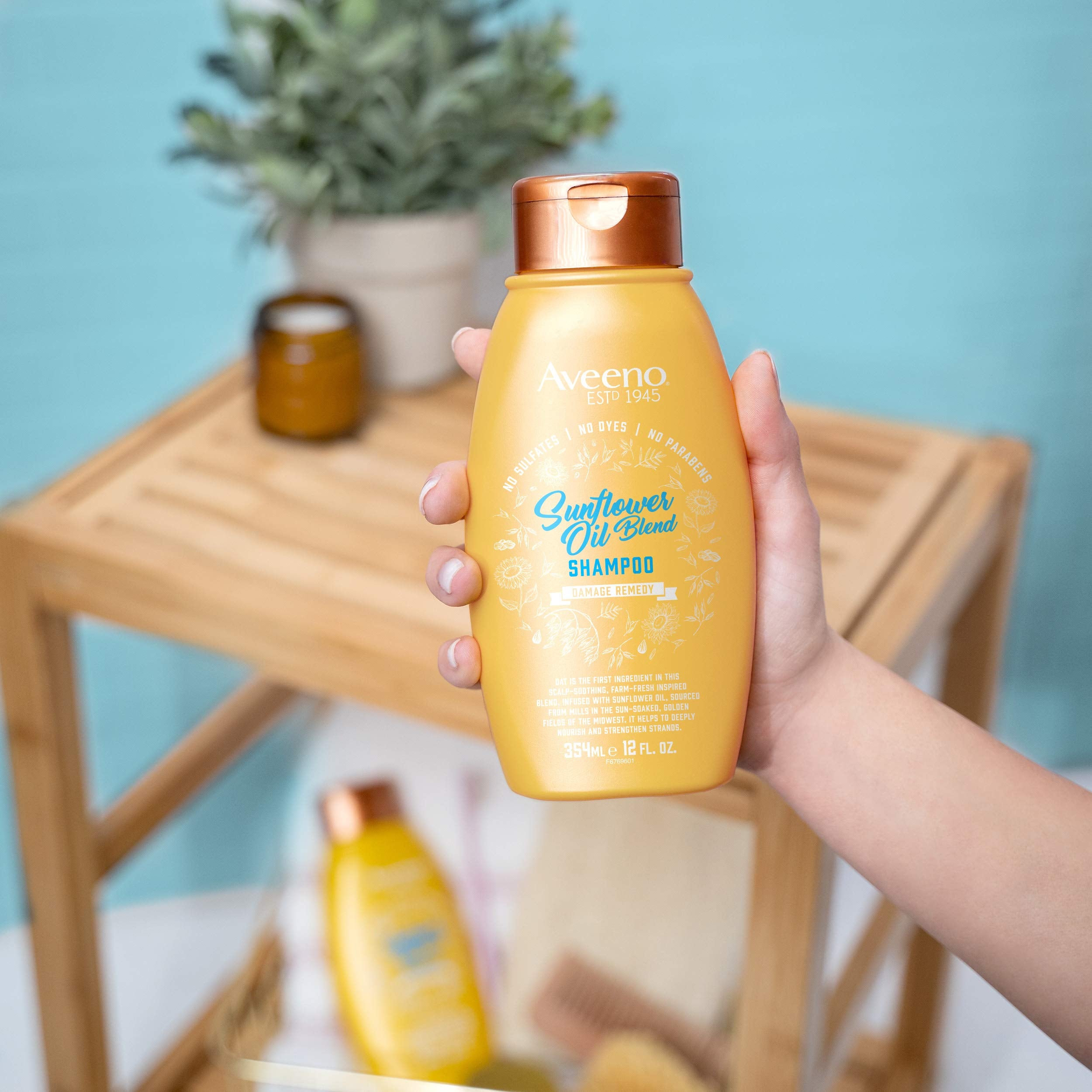 Aveeno Deep Moisturizing Sunflower Oil Blend Shampoo bathroom setting ideal for routine wash