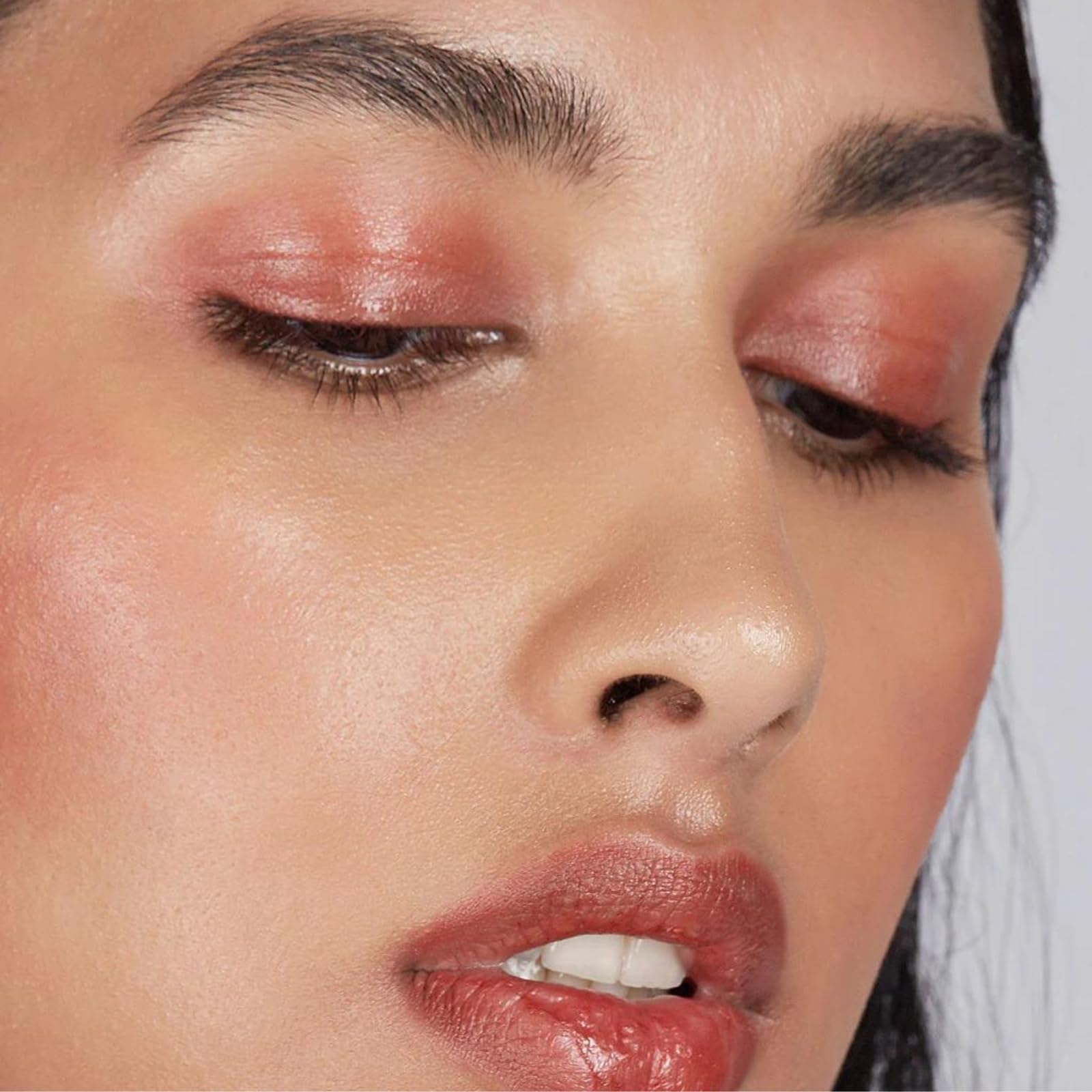 Axiology Balmie applied to cheeks for lightweight flush.