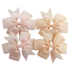 Babymatch pinwheel bow with clip provides secure attachment during active play.