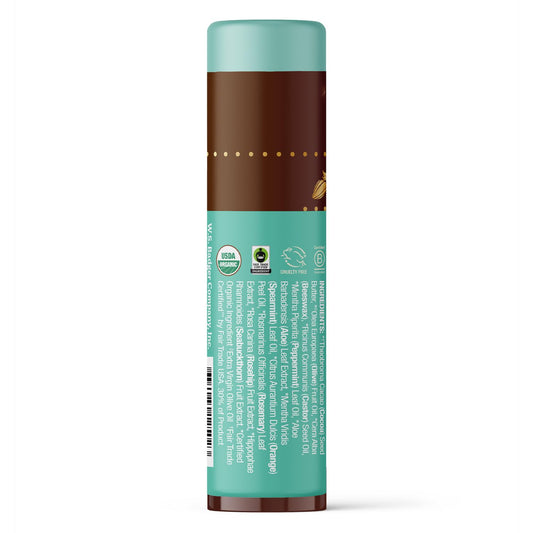 Applying Badger lip balm shows creamy texture and minty aroma on lips.