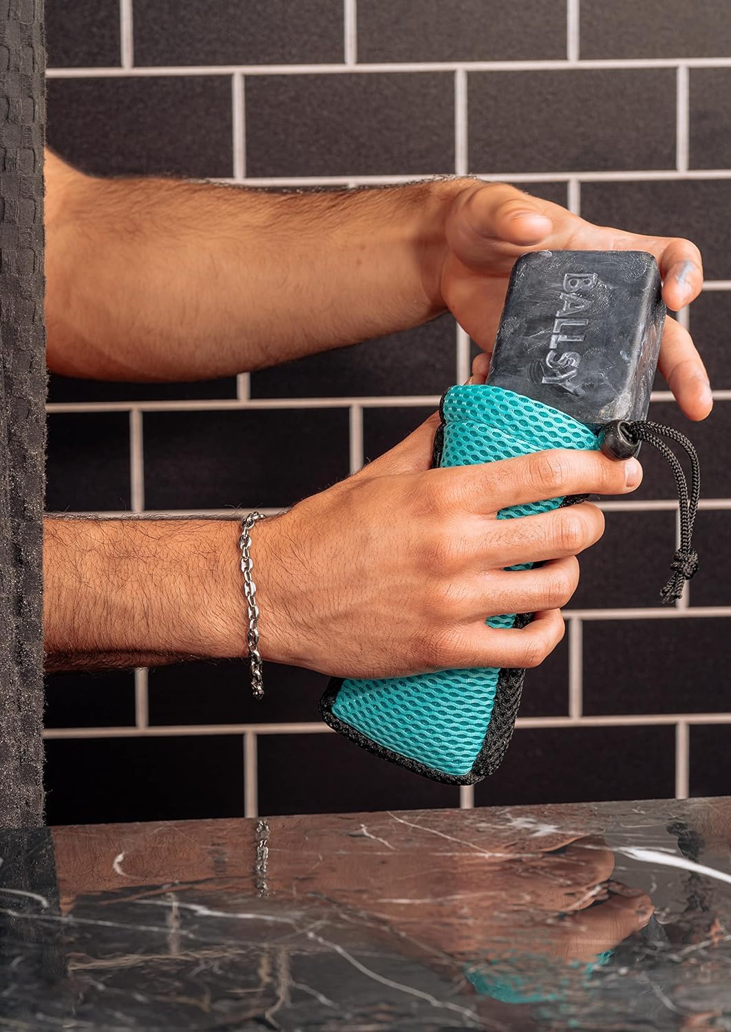 Ballsy Handy Shower Tool in the shower showing soap lather and grip.