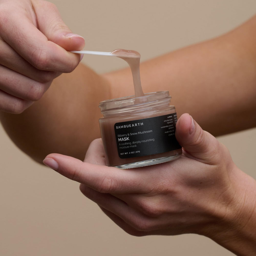 BAMBU EARTH Bilberry and Snow Mushroom Mask application on skin demonstrates smooth spreading.
