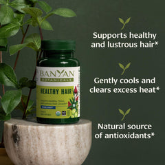 Banyan Botanicals Healthy Hair Tablets bottle back with organic ingredients and sustainability.