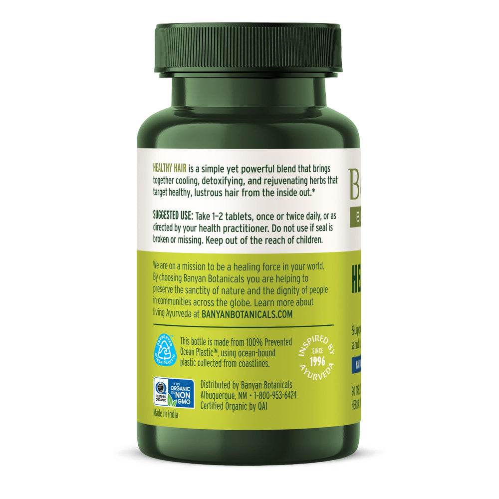 Banyan Botanicals Healthy Hair Tablets lifestyle shot with routine setup.