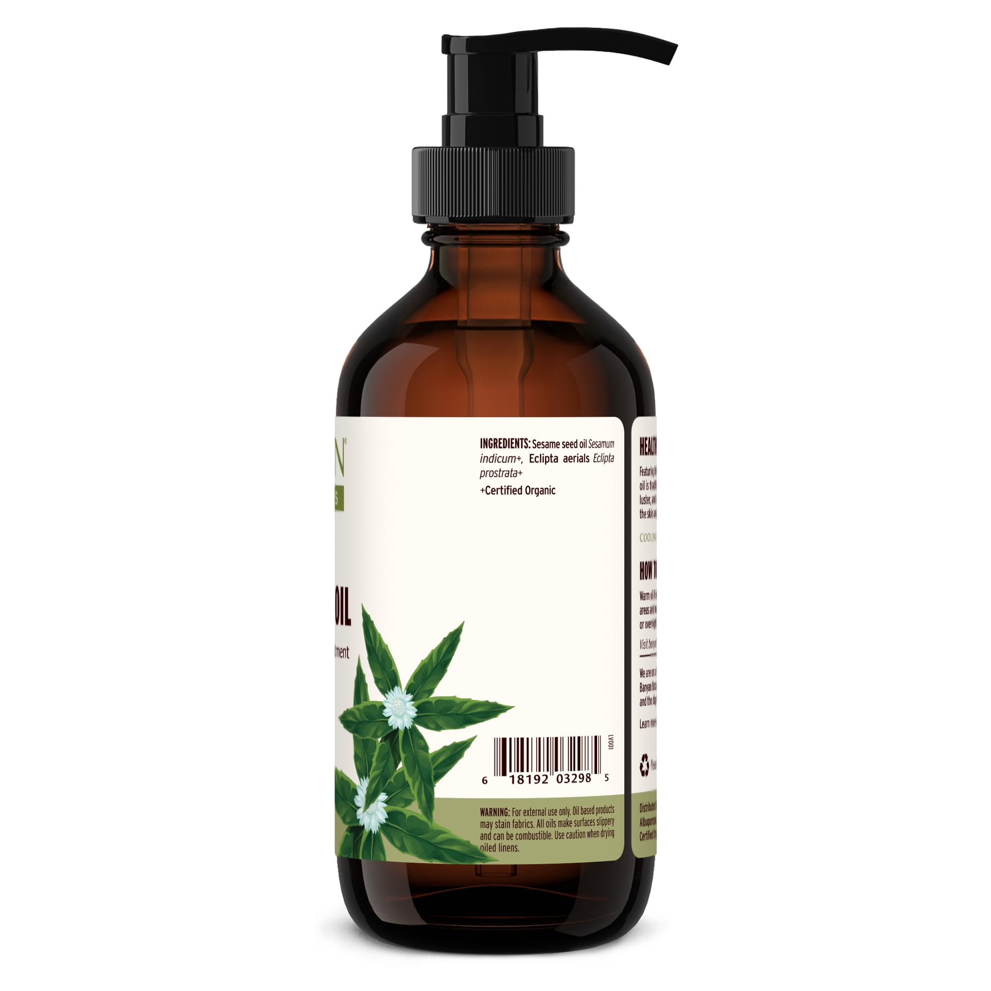 Banyan Botanicals Bhringaraj Oil bottle in use for root nourishment.