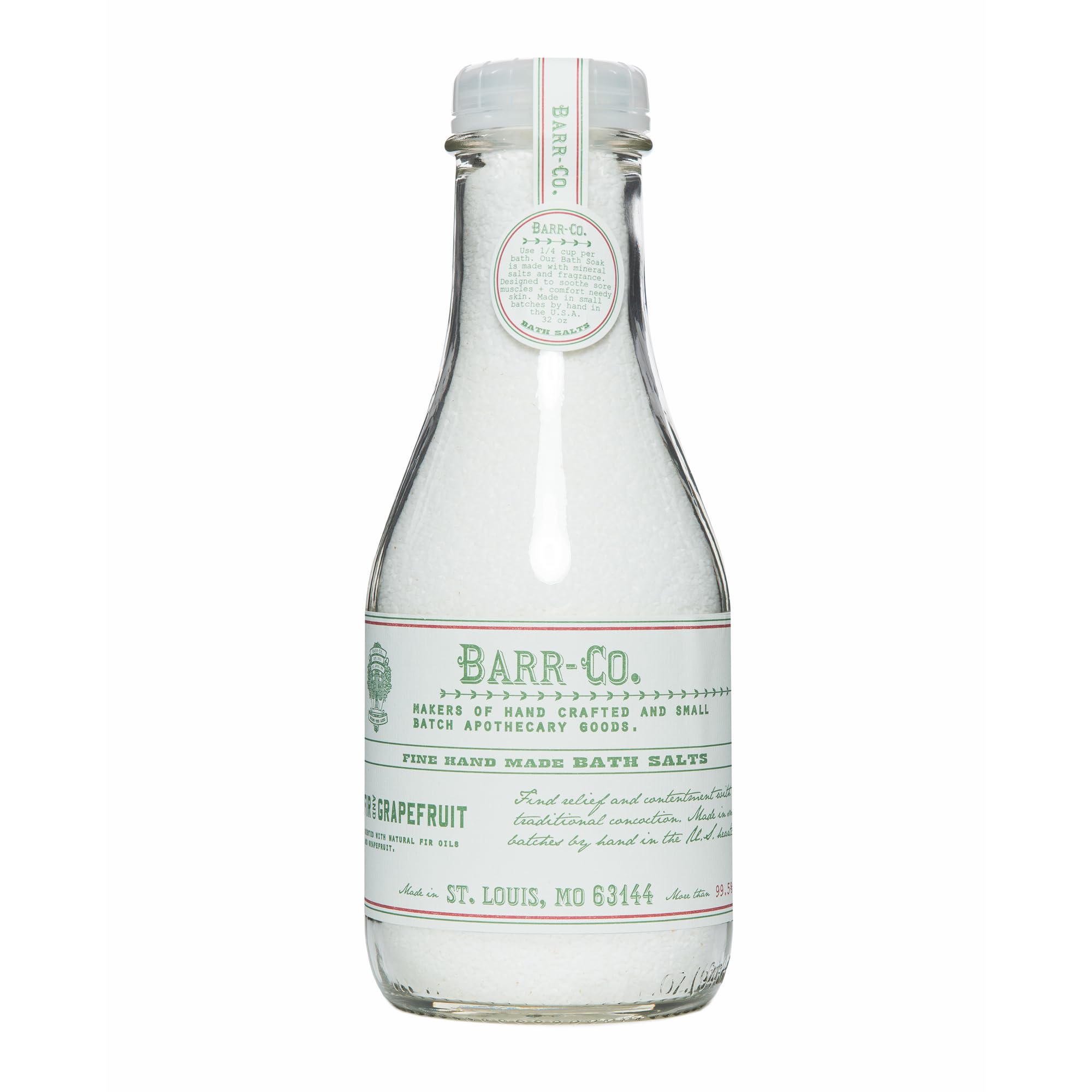 Barr-Co fir grapefruit bath salts jar shown in glass for relaxing soaks.