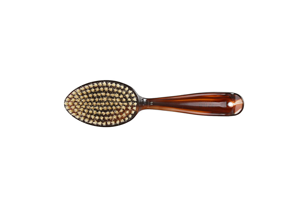 Close-up of Bass Hair Doc's high-polish acrylic handle and premium finish