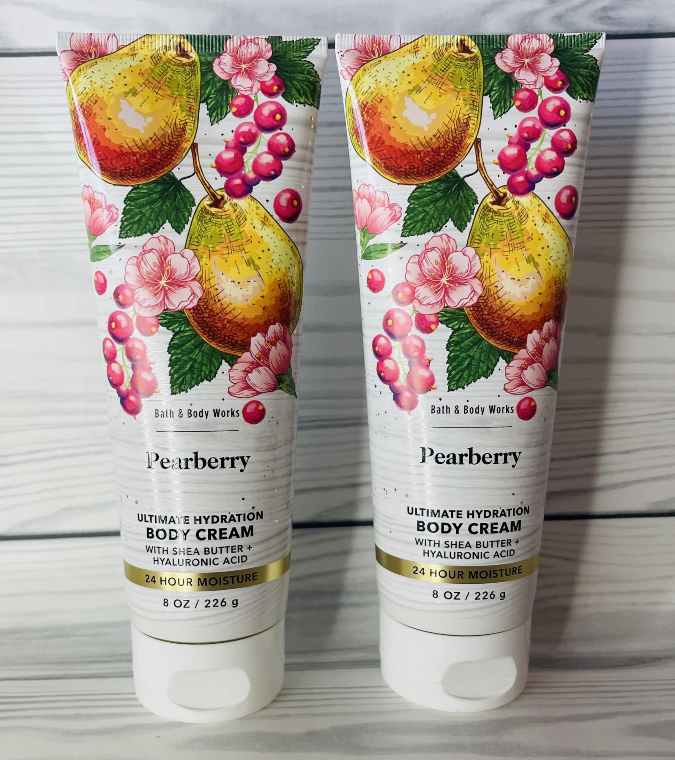 Bath & Body Works Pearberry cream bottle close-up, creamy texture for smooth skin.